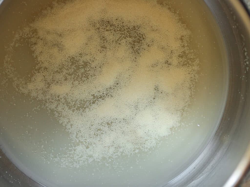 Proofed yeast in stand mixer bowl.